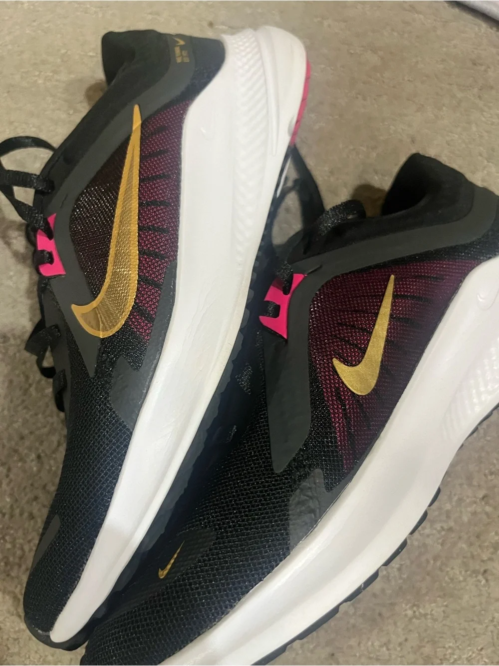 Nike Women’s Black/Purple Running Shoes with Gold Swoosh